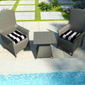 black and white striped chair pads on pool